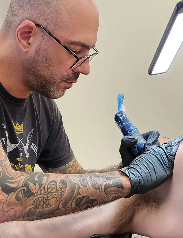 Aviv Rotshas tattooing